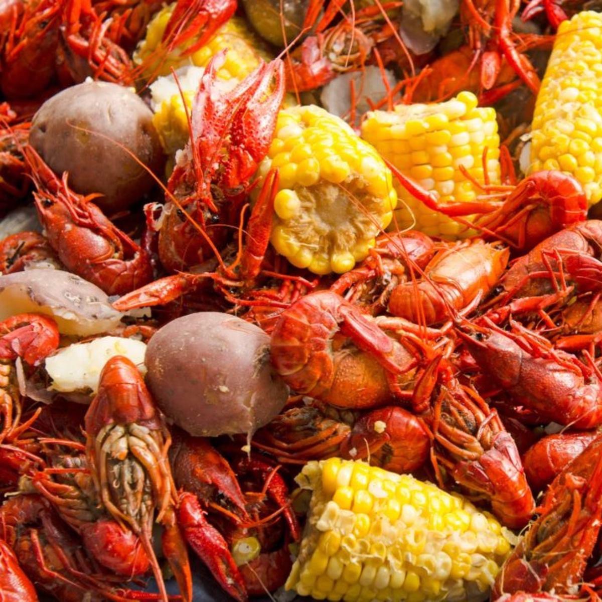 Cajun seafood boil platter with crab, shrimp, and corn